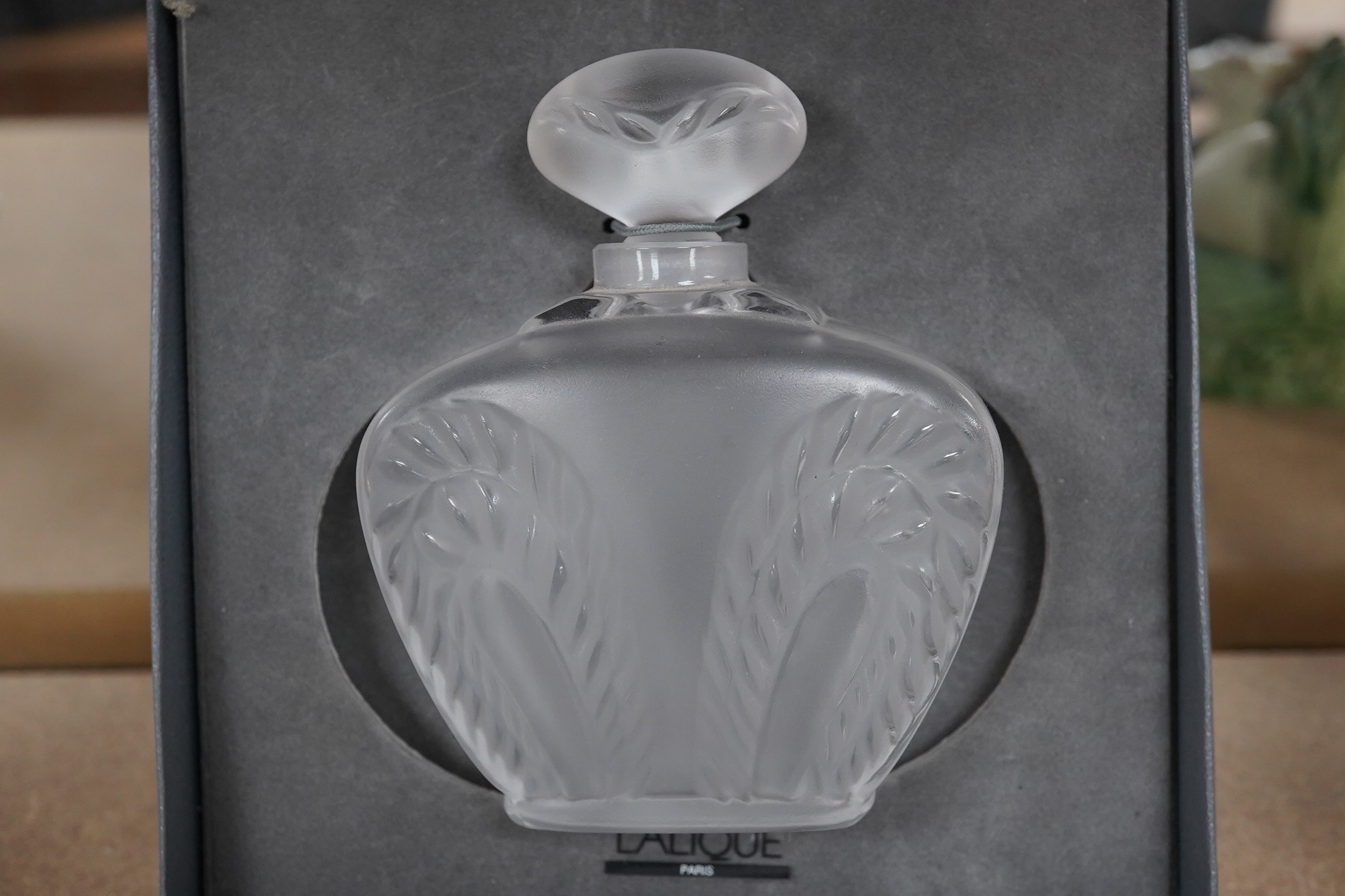 A Lalique ‘Singapore’ pattern frosted glass scent bottle and stopper in associated Lalique box, bottle 10cm. Condition - good